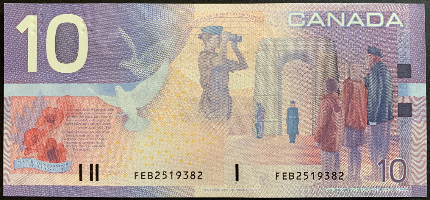 Back of the 2001 Canada 10 Dollar banknote (P-102b) showing the Remembrance and Peacekeeping theme with veterans, peacekeepers, and poppy imagery in XF condition.