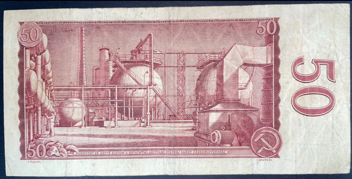 Reverse of a Czechoslovakia 50 Korun 1964 banknote, depicting an industrial factory complex with machinery, pipes, storage tanks, and a hammer and sickle emblem.