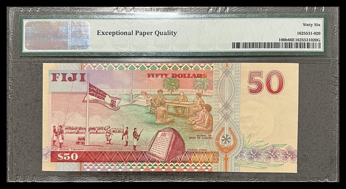 Back view of a Fiji 50 Dollars banknote in a PMG holder showing the flag-raising ceremony, signing of the Deed of Cession and the Cession Stone at Levuka.