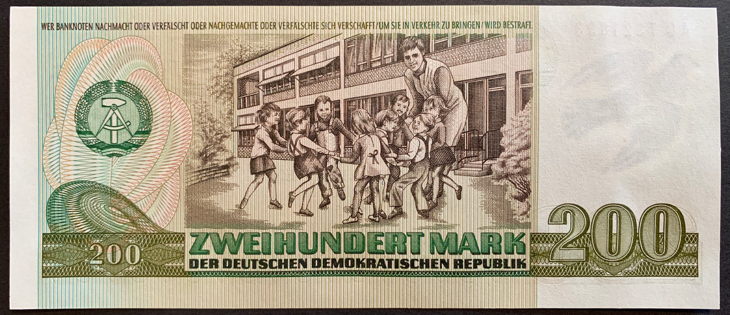 Germany, GDR 200 Mark 1985 P-32 UNC vintage banknote with teacher playing with schoolchildren