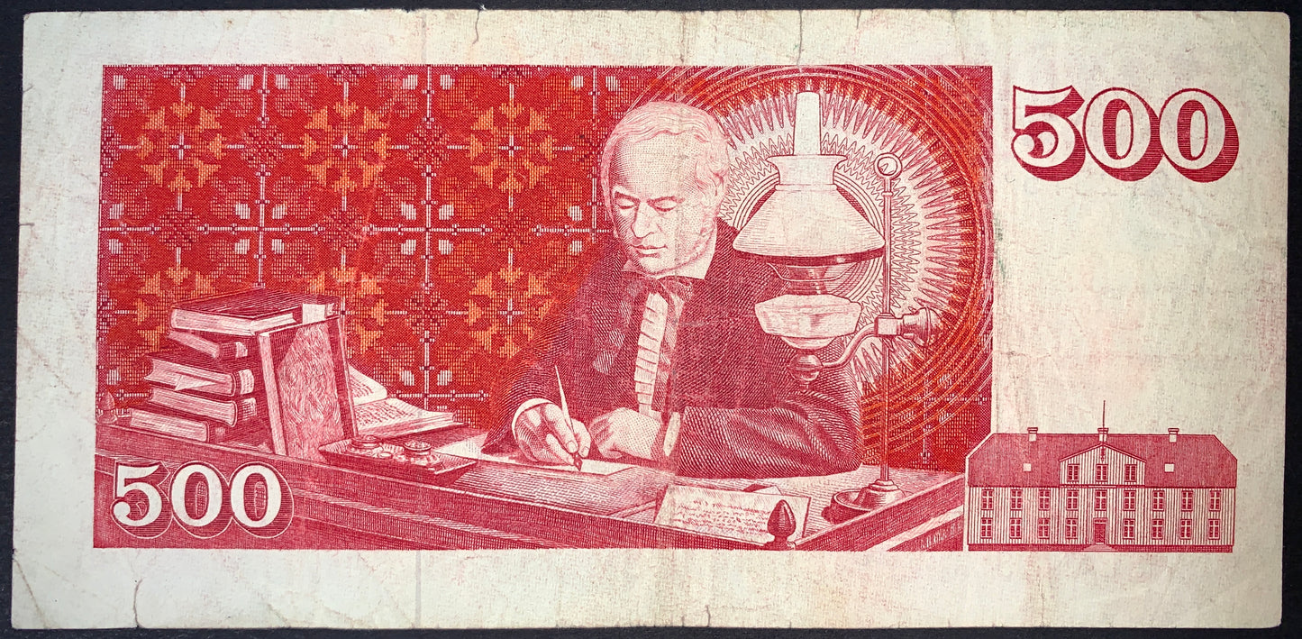 back of Iceland 500 Kronur 1961 P-51 F collectible vintage banknote with Jón Sigurðsson is depicted at his desk, immersed in writing and scholarship
