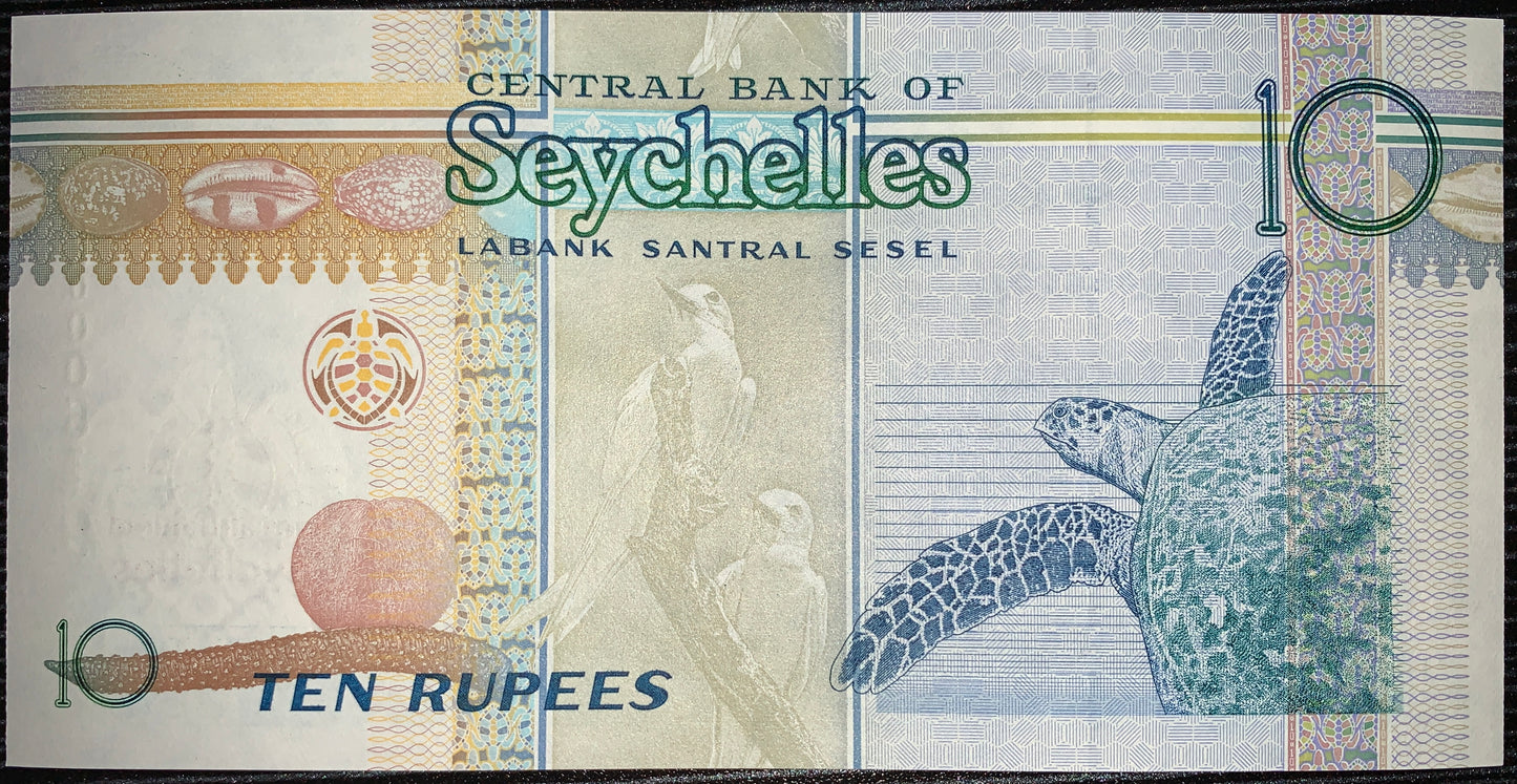 back of Seychelles 10 Rupees 2013 P-46 UNC Commemorative Banknote collectible modern banknote with Fairy Terns and Hawksbill Sea Turtle
