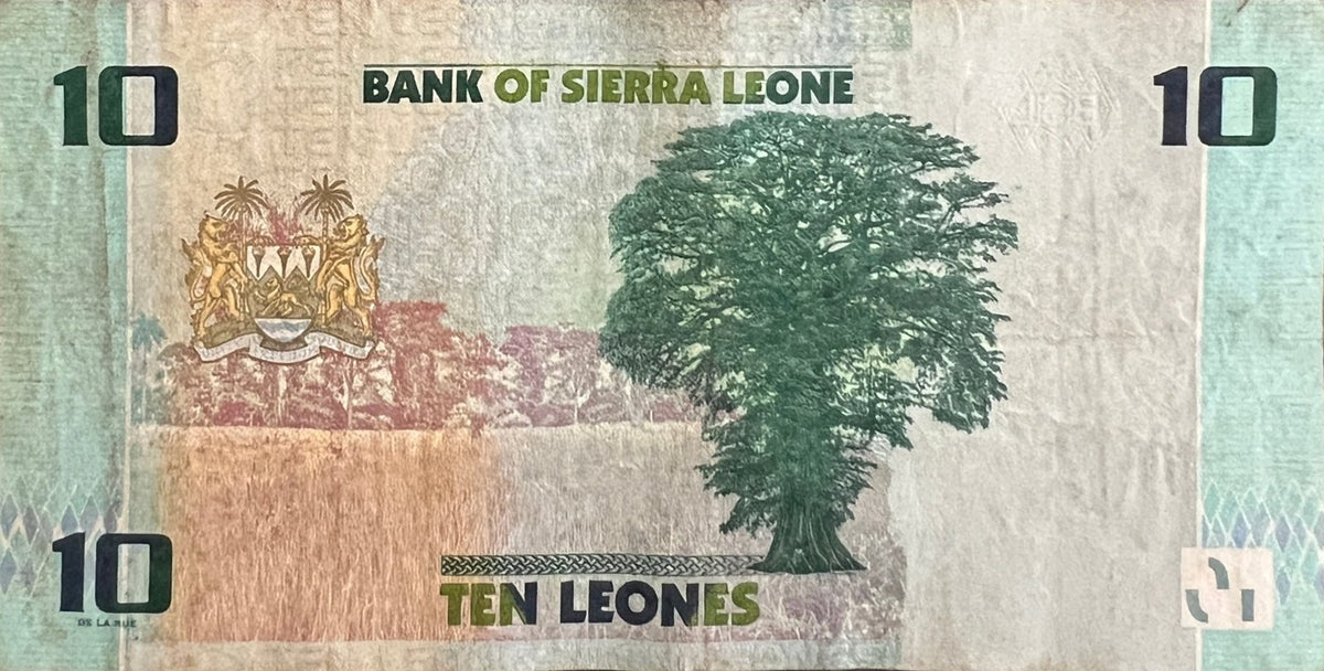Back view of a 2022 Sierra Leone 10 Leones banknote showing the coat of arms and the Cotton Tree of Freetown.