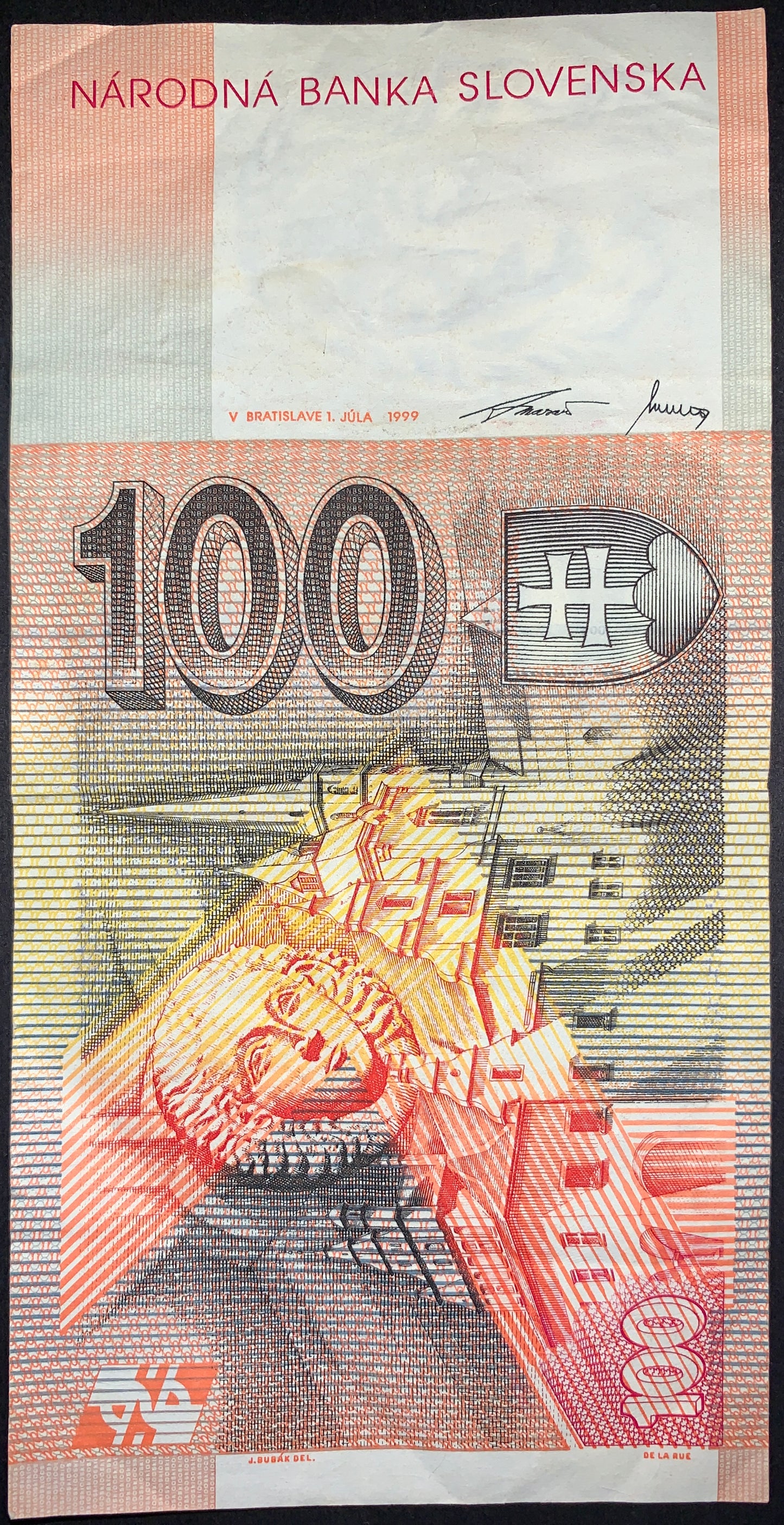 Reverse of the Slovak 100 korún note showing the historic town of Levoča and architectural details connected to Master Paul. Features detailed engraving, cultural imagery, and official Národná banka Slovenska design elements.