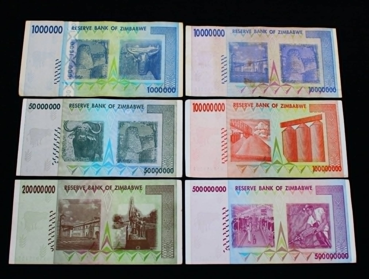 Collection of Zimbabwean banknotes with varying denominations and designs.