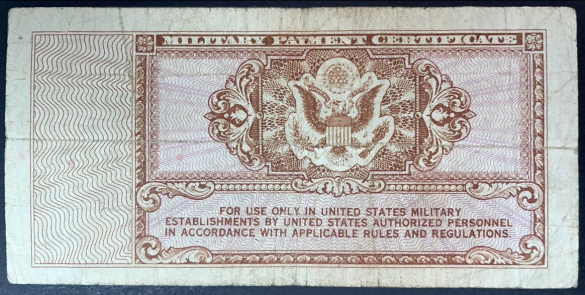 Reverse of a 1948 US Military Payment Certificate 10 Cents, Series 472, featuring the US eagle emblem and ornate engraved border.