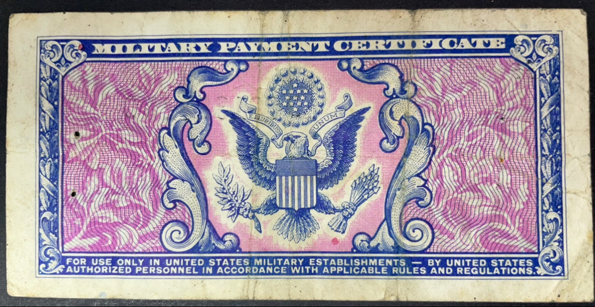 Reverse of a 1951 US Military Payment Certificate 5 Cents, Series 481, featuring a detailed American eagle holding an olive branch and arrows, surrounded by ornate blue and pink engraving.