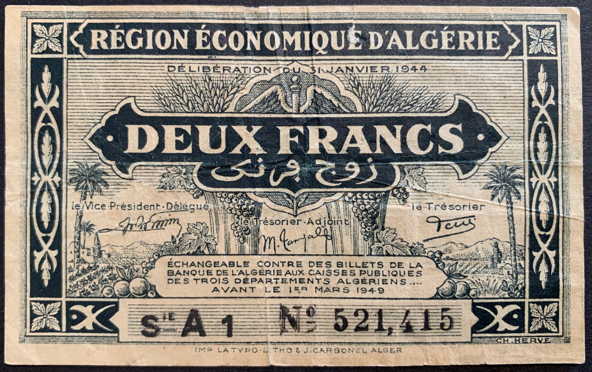 front of Algeria 2 Francs 1944 P-99a collectible vintage banknote with floral frame; country scene represented by palm trees, fruits, a sheaf of wheat, an agricultural field and a village in the distance
