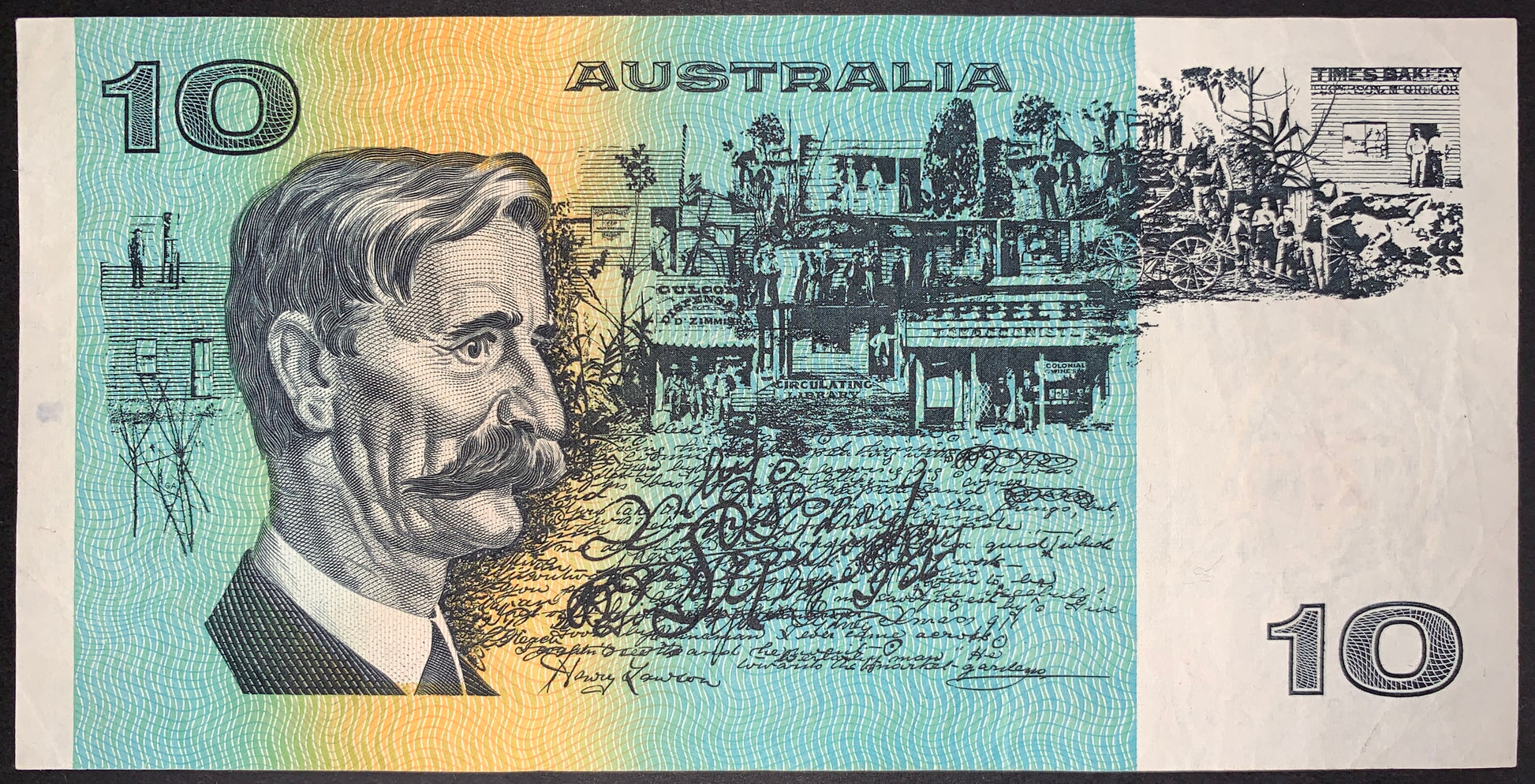 Australia 10 Dollar Banknote reverse featuring Henry Lawson portrait, Australian heritage scenes and handwritten manuscript design