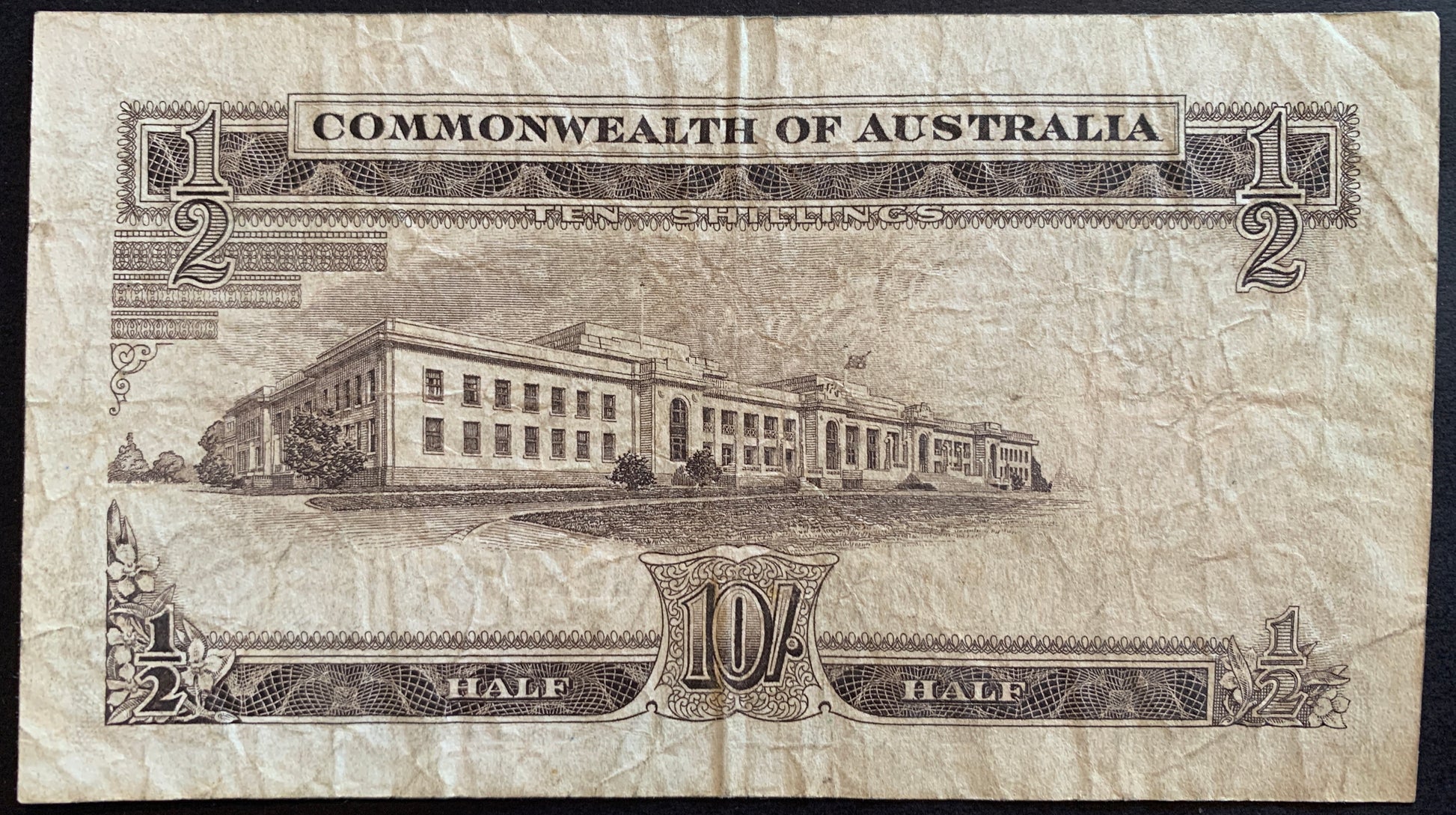 back of Australia 10 Shillings Reserve Bank ND (1961-1965) P-33a F collectible vintage banknote with building of Parliament House in Cenberra