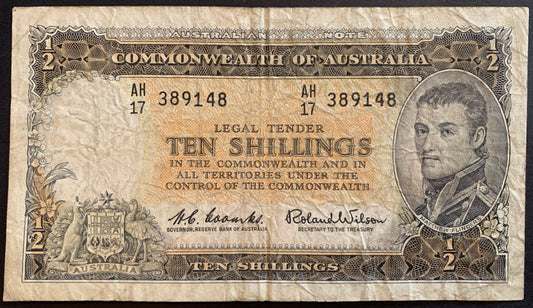 front of Australia 10 Shillings Reserve Bank ND (1961-1965) P-33a F collectible vintage banknote with portrait of Matthew Flinders, orchids, and coat of arms