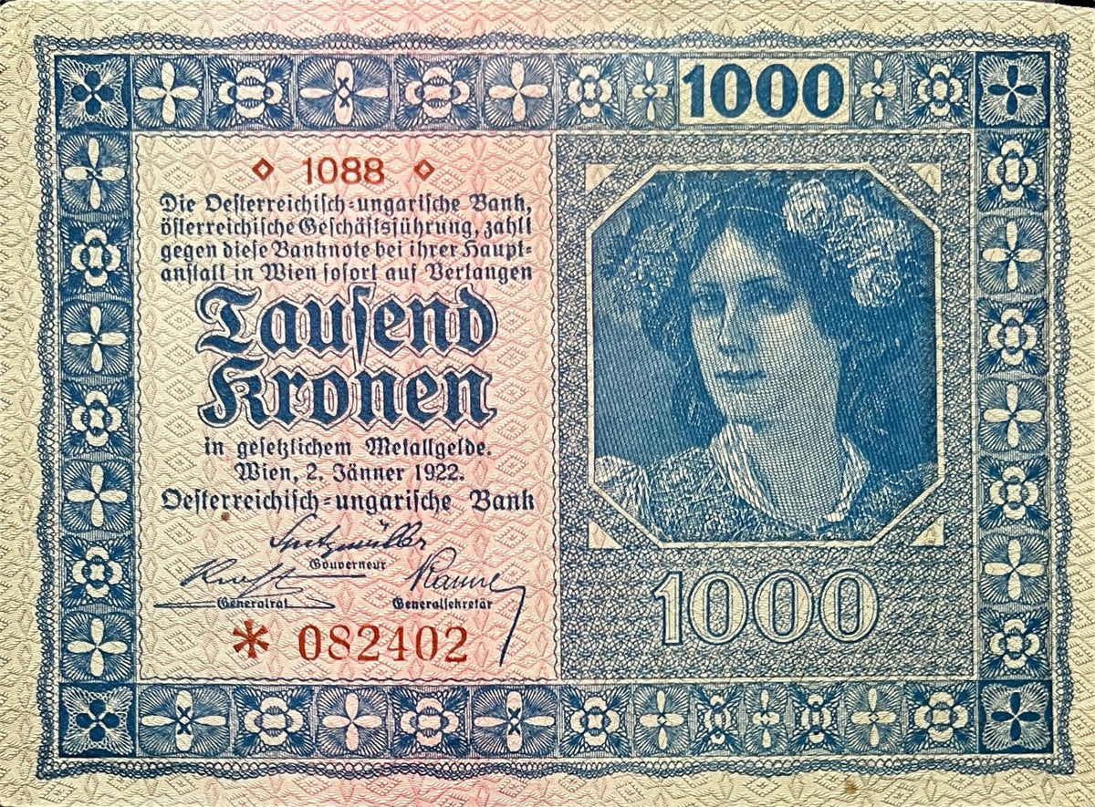 Front view of a very fine 1922 Austria 1000 Kronen banknote featuring a young woman with a floral wreath in an octagonal frame.