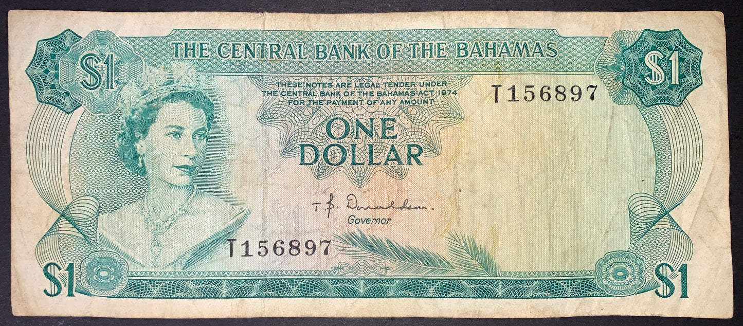 front of Bahamas 1 Dollar 1974 P-35a F/VF collectible vintage banknote with portrait of Queen Elizabeth II