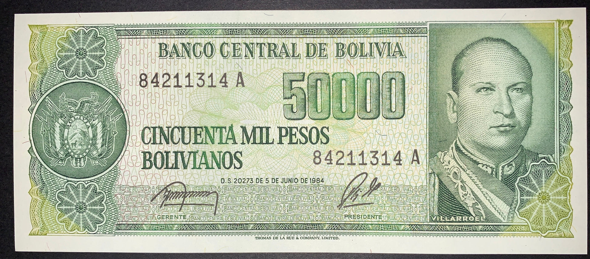 Obverse of an authentic Bolivia 50,000 Pesos Bolivianos banknote, 1984 issue, Pick P-170. Displays a portrait of President Gualberto Villarroel, the Bolivian coat of arms, decorative security patterns, and crisp engraved details.