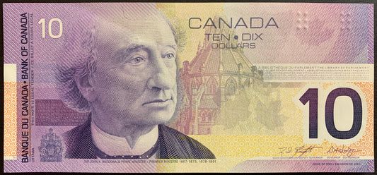 Front of the 2001 Canada 10 Dollar banknote (P-102b) featuring Sir John A. Macdonald, the Canadian Coat of Arms, and modern security features in XF condition.