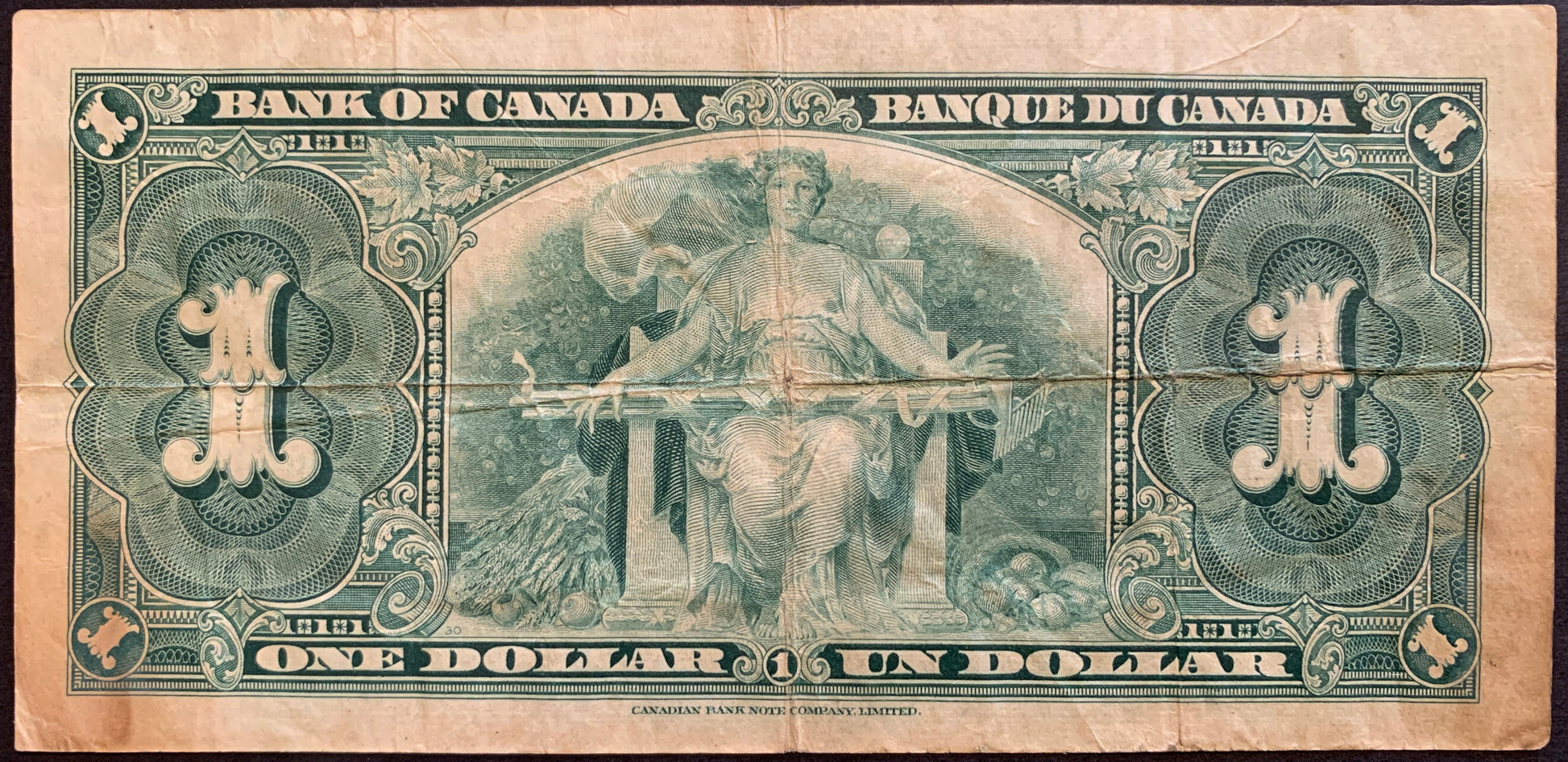 back of Canada 1 Dollar 1937 P-58d F collectible banknote with allegory of Agriculture