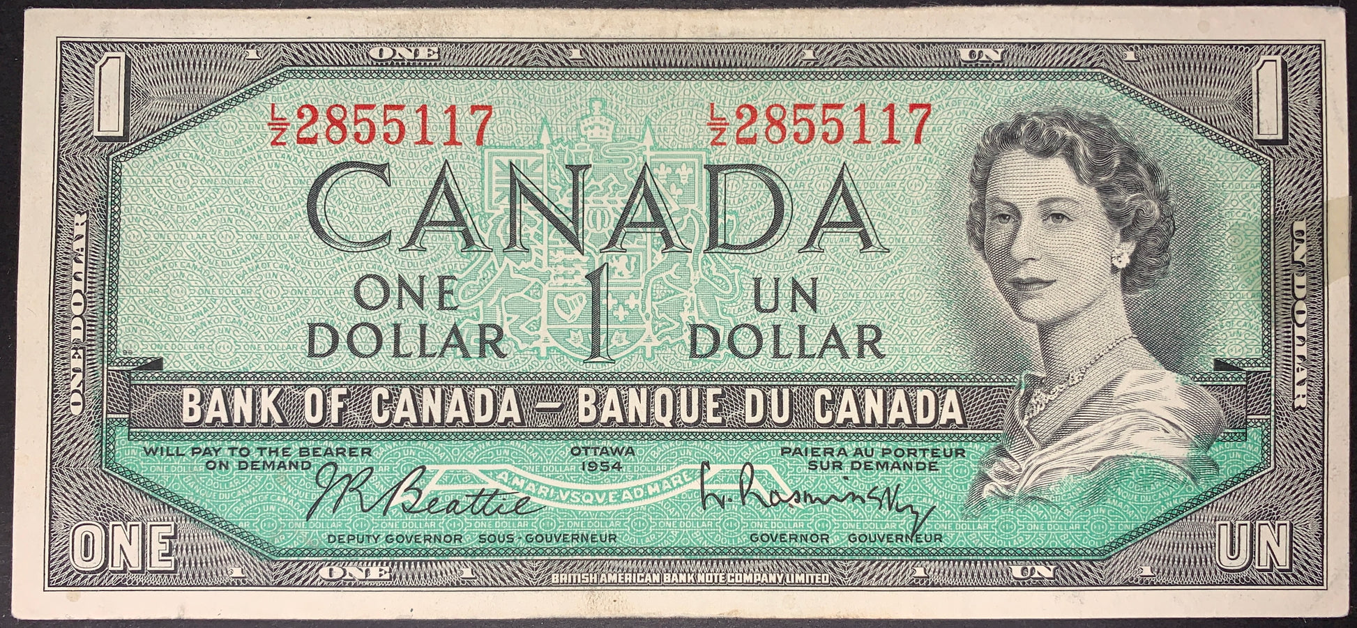 front of Canada 1 Dollar 1954 P-74b collectible vintage banknote with portrait of young Queen Elizabeth II
