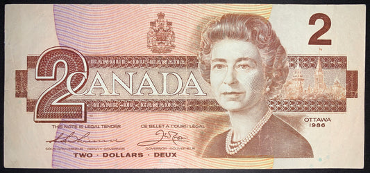 front of Canada 2 Dollars 1986 P-94 F collectible vintage banknote with portrait of Queen Elizabeth II