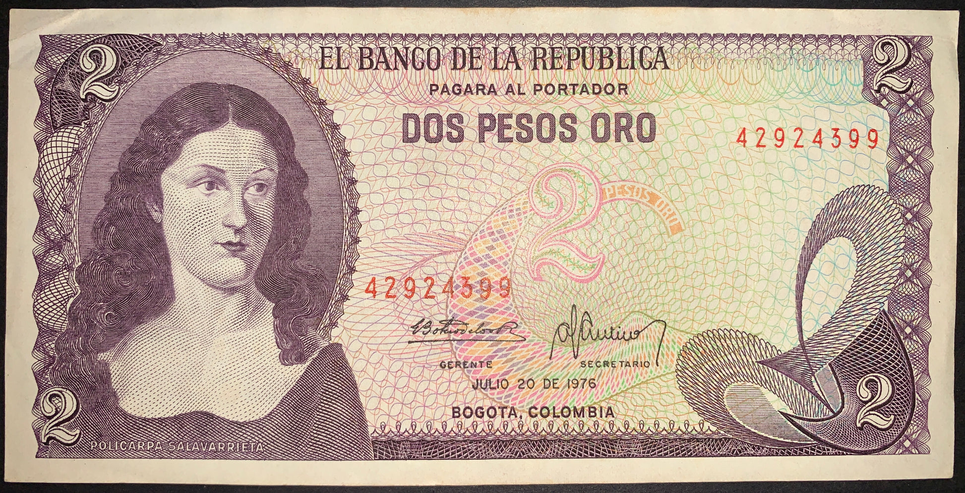 front of Colombia 2 Pesos Oro 1976 P-413b VF collectible banknote with portrait of woman