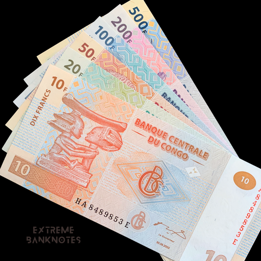 Collection of Congolese banknotes from different denominations on a black background