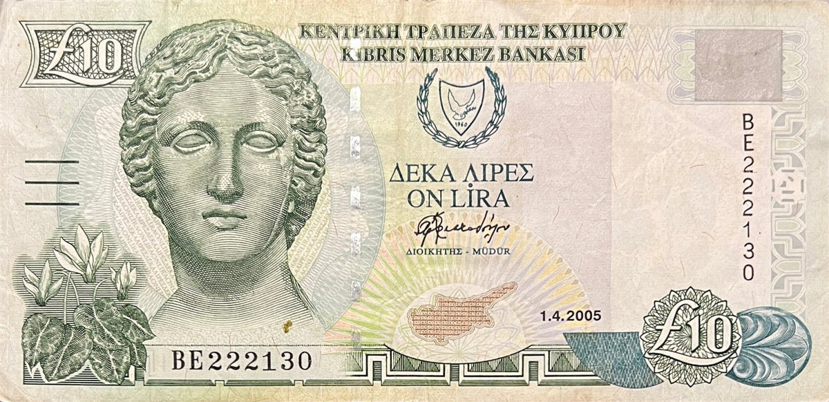 Front view of a circulated 2005 Cyprus 10 Pounds banknote featuring a marble bust of the goddess Artemis with cyclamen flowers.