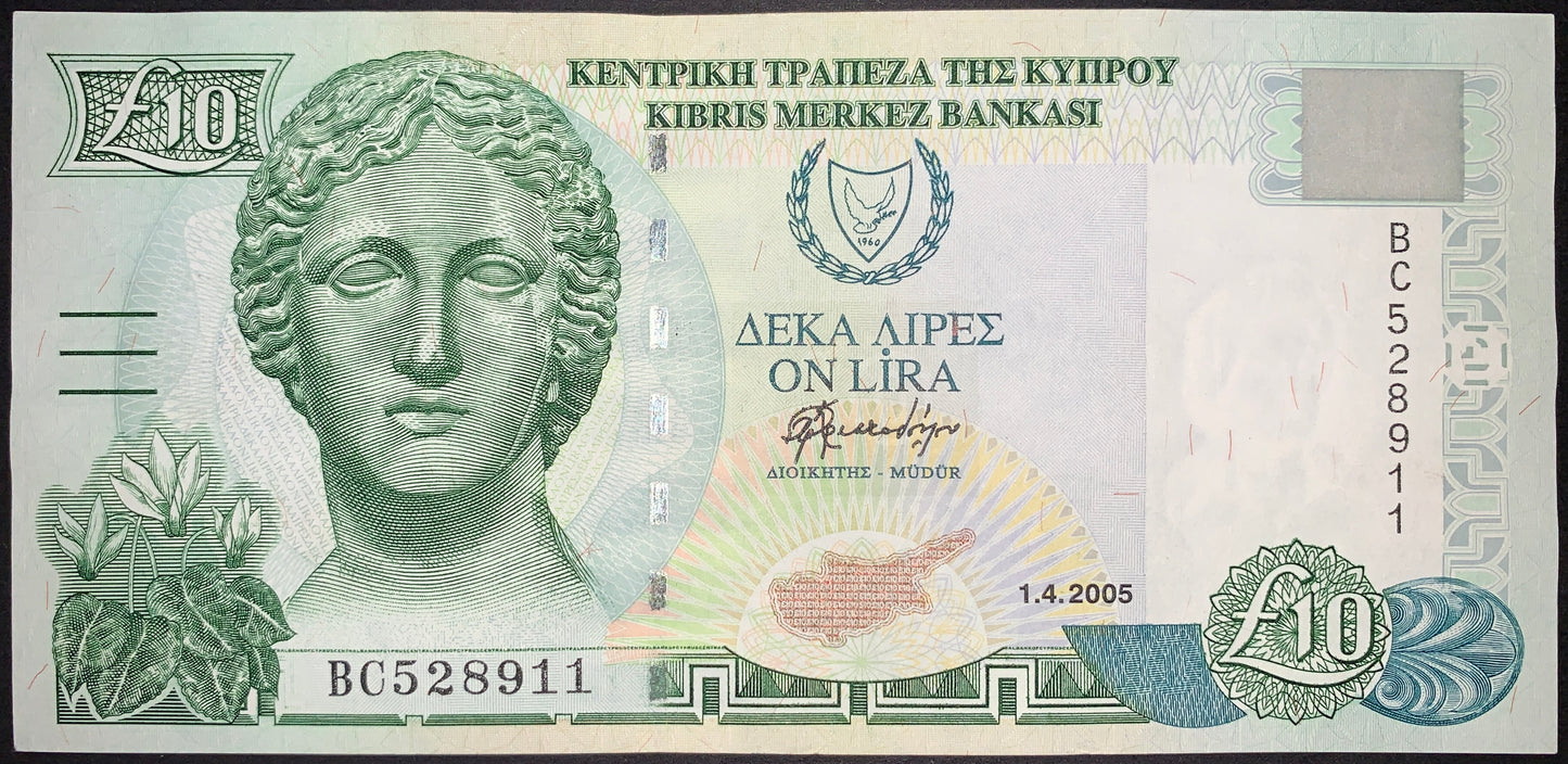 Cyprus 10 Pounds banknote dated 1 April 2005, featuring a classical female sculpture portrait, Cyprus national emblem, map of Cyprus, intricate security patterns, and multilingual inscriptions from the Central Bank of Cyprus.