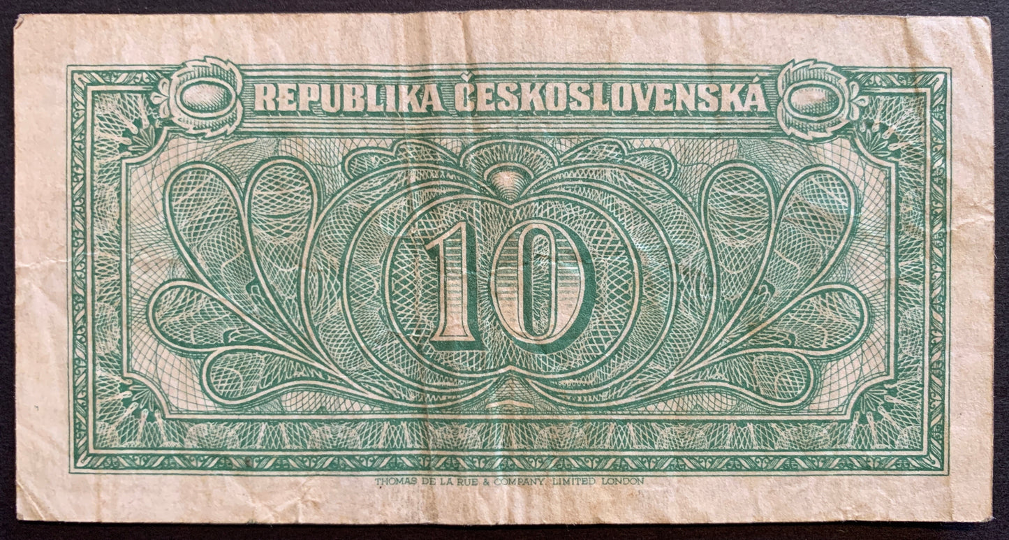 Back of vintage Czechoslovakia 10 Korún 1945 P-60 collectible banknote showing symbolic design elements and mid-20th-century patterns.