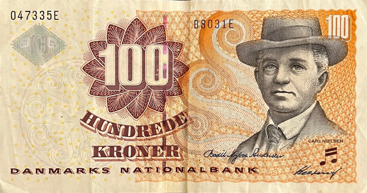 Front view of a very fine Denmark 100 Kroner banknote featuring composer Carl Nielsen in a hat, a musical note and the hologram.
