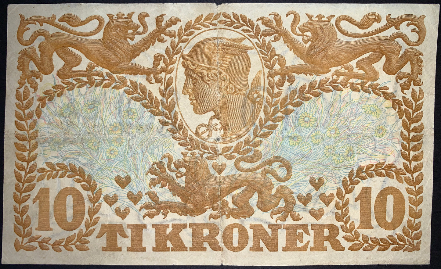 back of Denmark 10 Kronen 1943 P-31o G collectible vintage banknote with Depiction of Mercury Surrounded by three lions