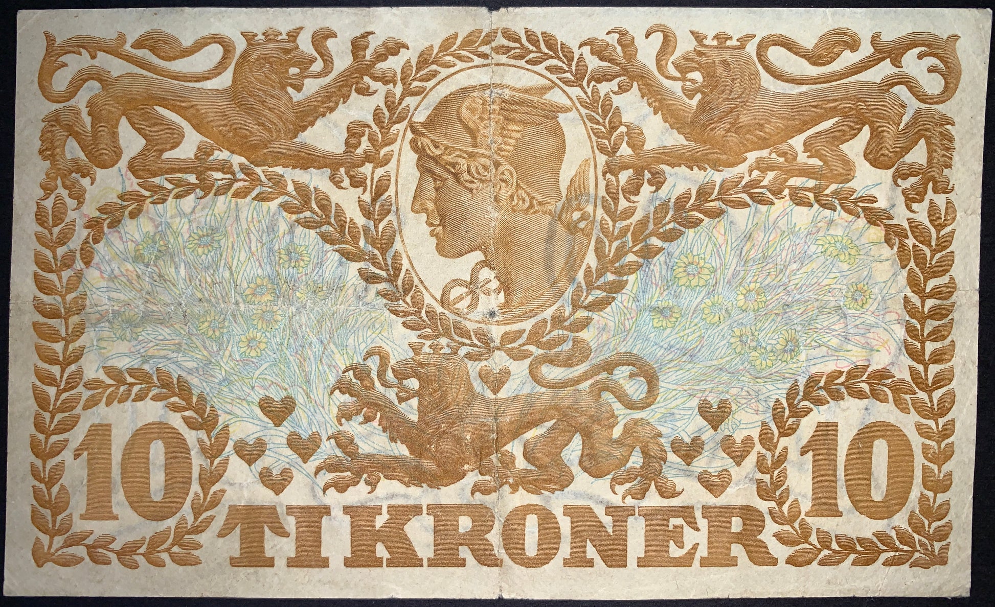 back of Denmark 10 Kronen 1943 P-31o G collectible vintage banknote with Depiction of Mercury Surrounded by three lions