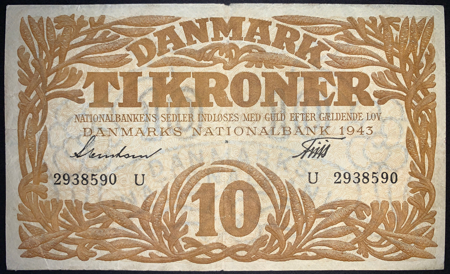 front of Denmark 10 Kronen 1943 P-31o G collectible vintage banknote with seaweed border decoration