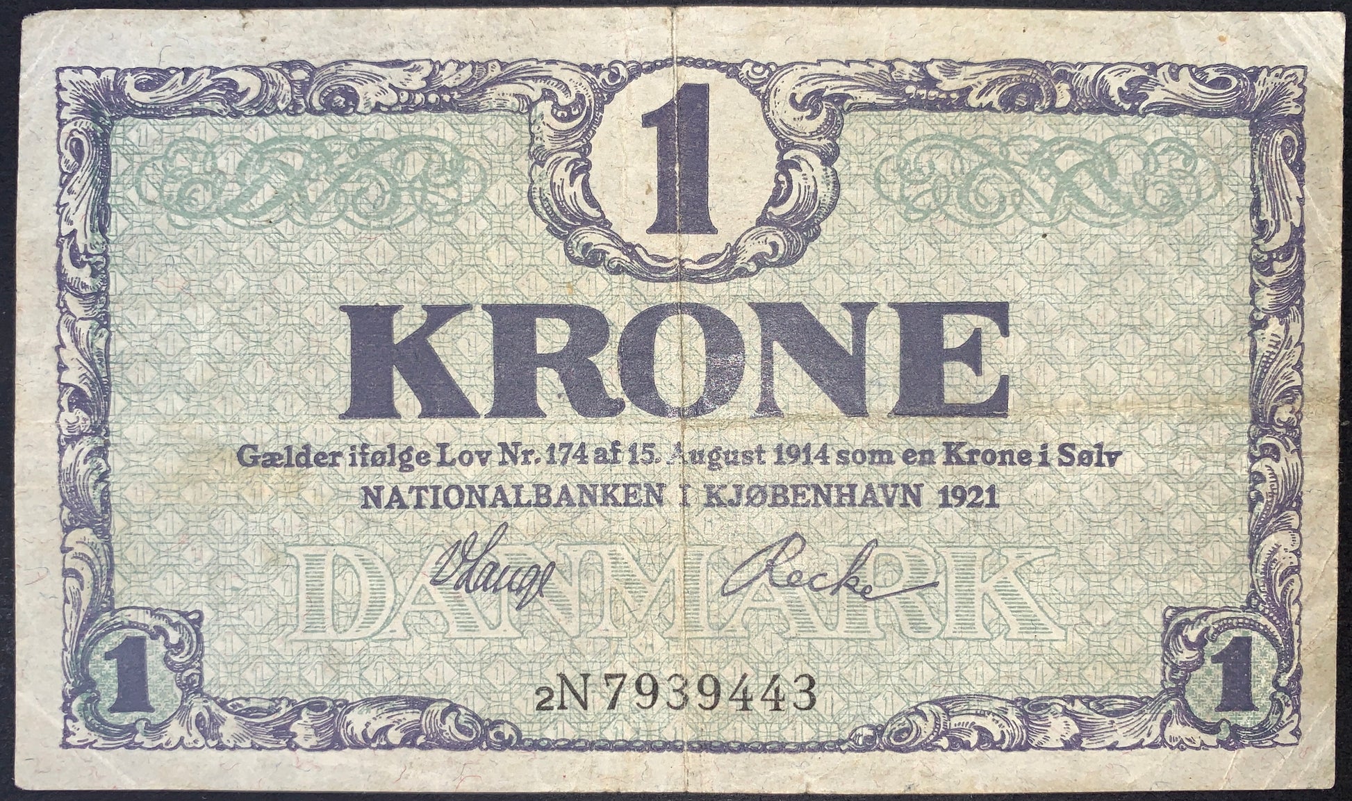 1921 Denmark 1 Krone banknote direct obverse front view P-12g Fine condition authentic historical Danish paper money showing ornate purple borders and green underprint text.