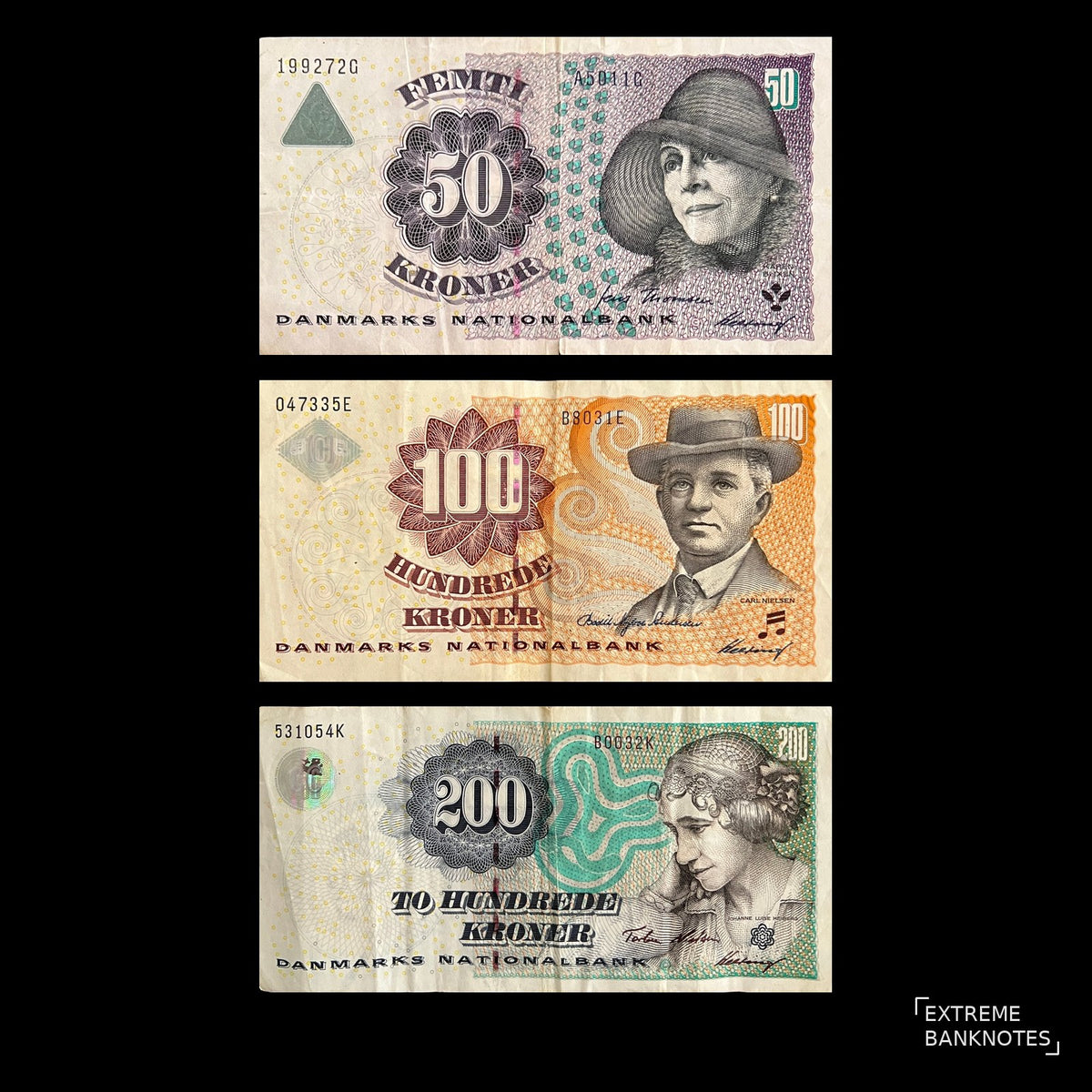 Front view of Denmark 50, 100 and 200 Kroner banknotes featuring Karen Blixen, Carl Nielsen and Johanne Luise Heiberg.