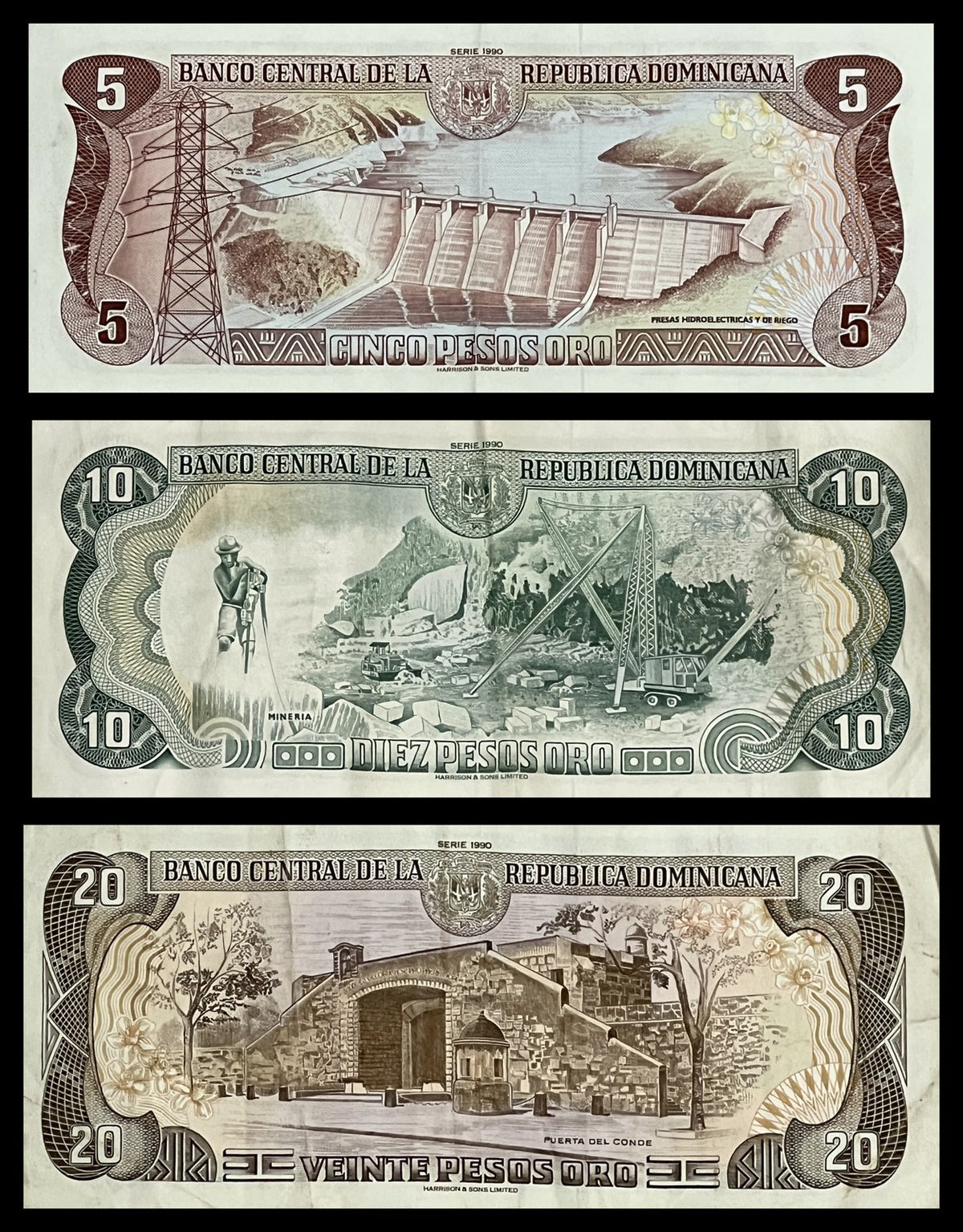 Back view of a 1990 Dominican Republic 5, 10 and 20 Pesos Oro set showing a hydroelectric dam, a mining scene and the Puerta del Conde in Santo Domingo.