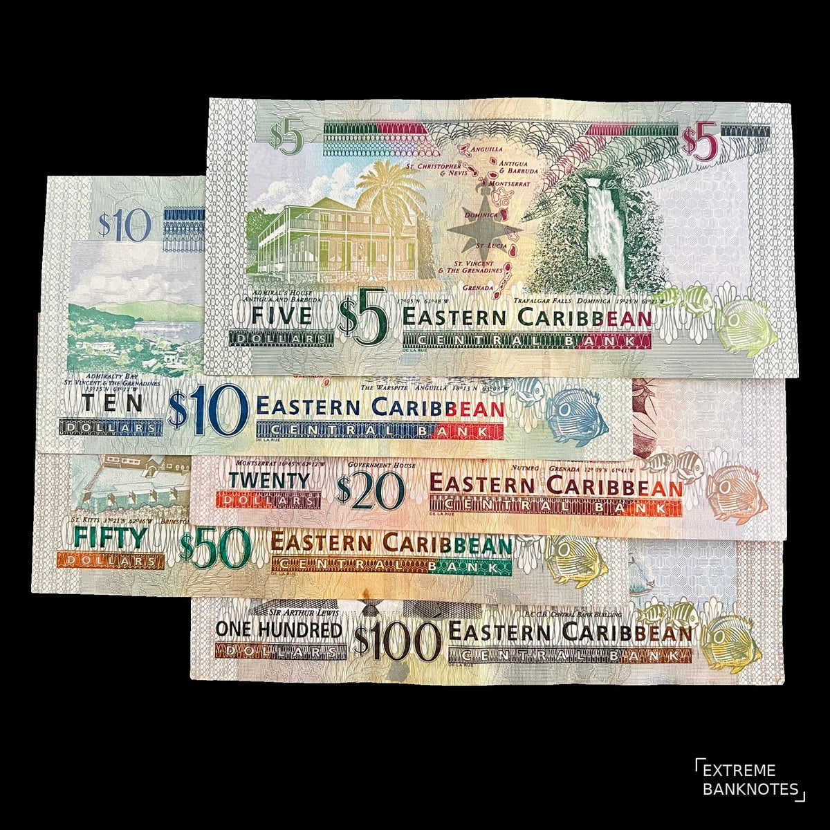 Back view of the Eastern Caribbean 5, 10, 20, 50 and 100 dollar banknotes showing island landmarks, the member-state map and Sir Arthur Lewis.
