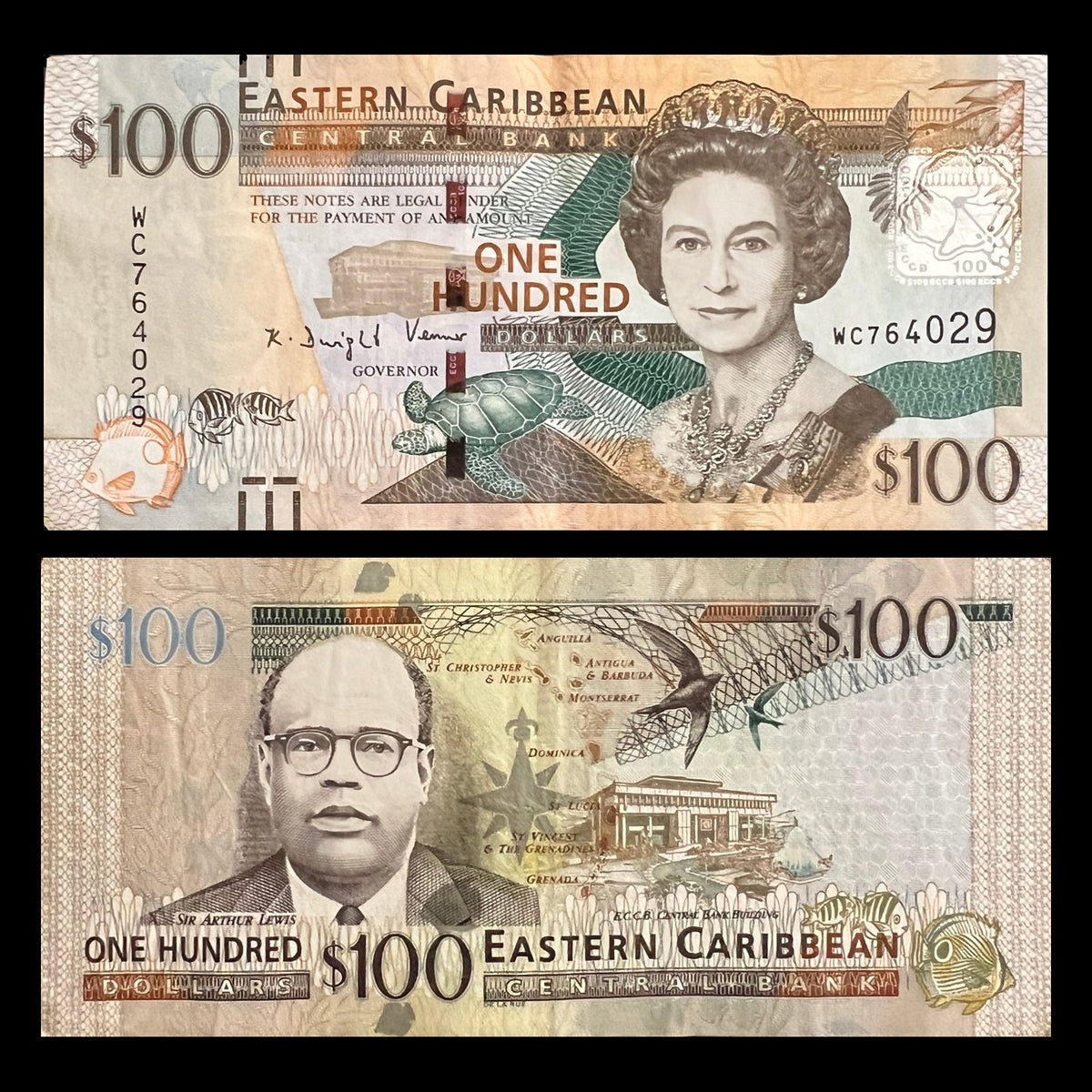 Eastern Caribbean 100 Dollars P-55 front with Queen Elizabeth II, back with Nobel laureate Sir Arthur Lewis and the Central Bank building.