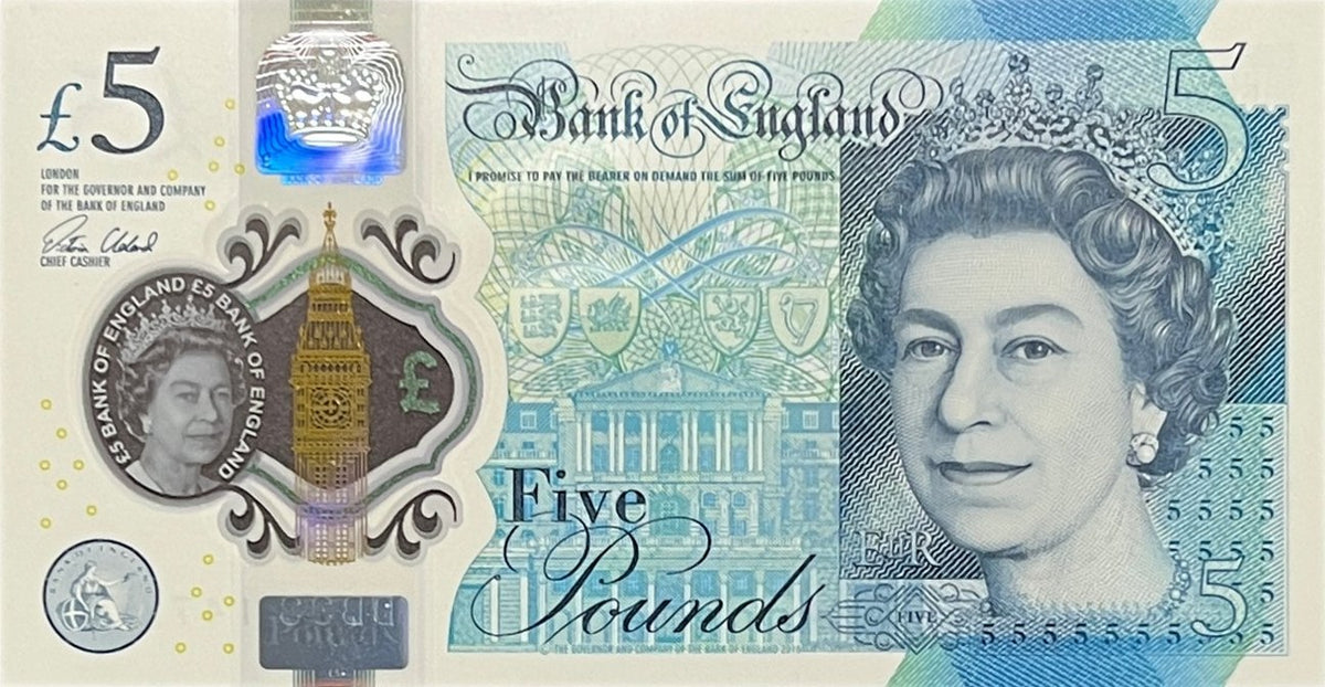Front view of an uncirculated Bank of England 5 Pounds polymer banknote featuring Queen Elizabeth II and Elizabeth Tower in a clear window.
