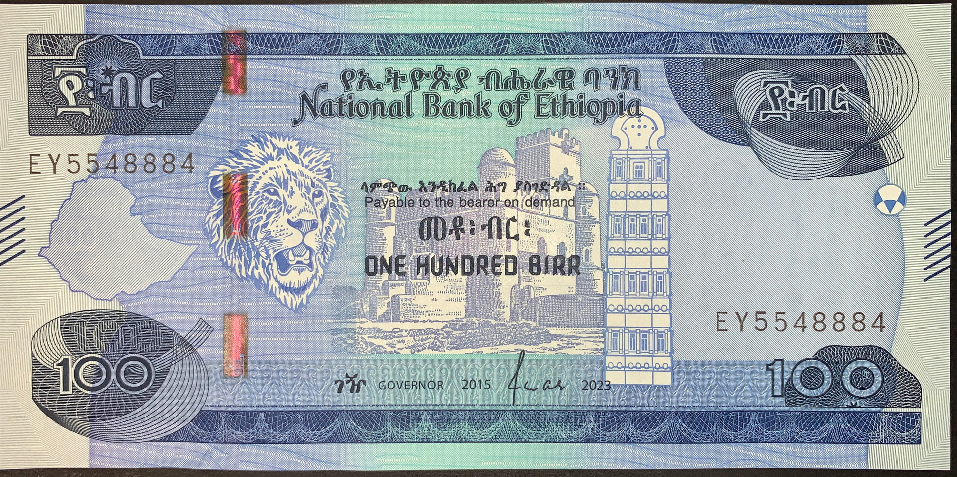 front of Ethiopia 100 Birr 2015 (2023) collectible modern banknote with Lion og Judah, map of Ethiopia, Emperor Fasilides’ Castle in Gondar and the Obelisk of Axum