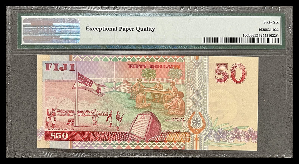 Back view of a Fiji 50 Dollars banknote in a PMG holder showing the flag-raising ceremony, signing of the Deed of Cession and the Cession Stone at Levuka.
