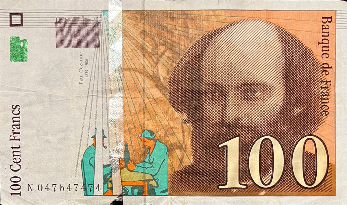 Front view of a very fine 1998 France 100 Francs banknote featuring a portrait of painter Paul Cézanne and figures from The Card Players.