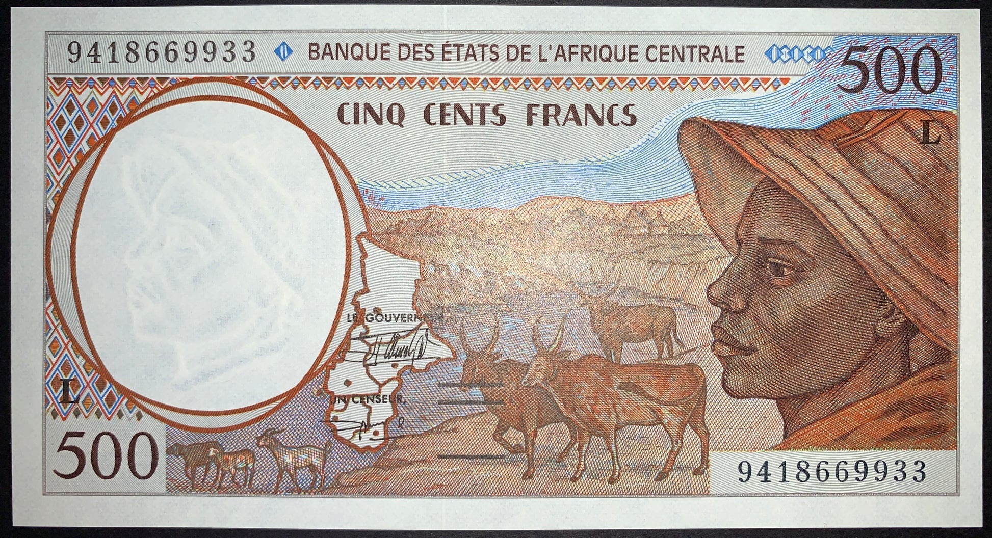 Obverse of the Gabon 500 Francs 1994 P-401Lb UNC banknote featuring a proud Central African shepherd, a herd of Zebu cattle, an outline map of the Central African States, and an antelope-head watermark. Authentic BEAC CFA Franc collectible.