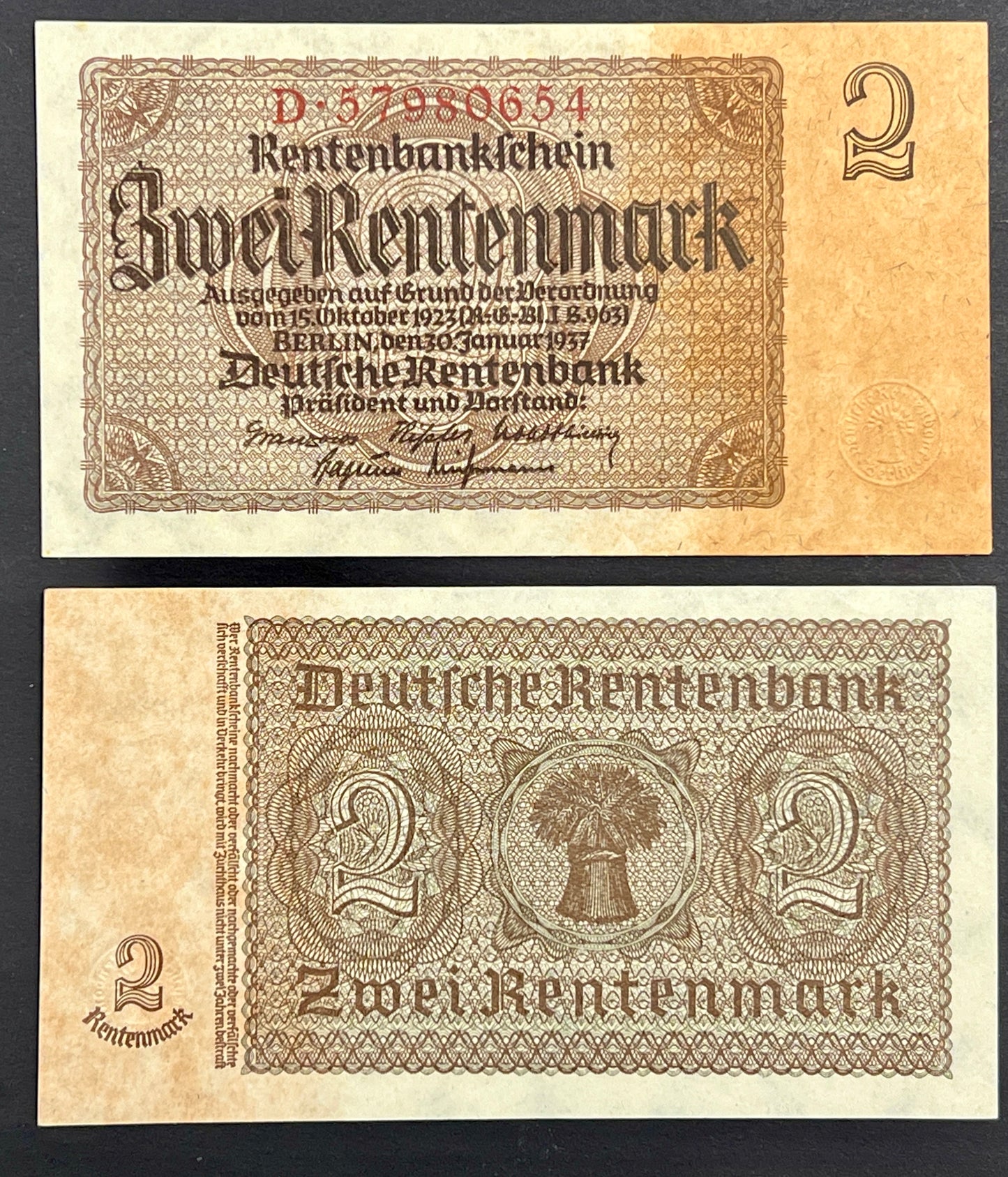 Front and reverse view of a crisp, vintage 1937 Germany 2 Rentenmark banknote featuring classic gothic typography and intricate geometric borders.

