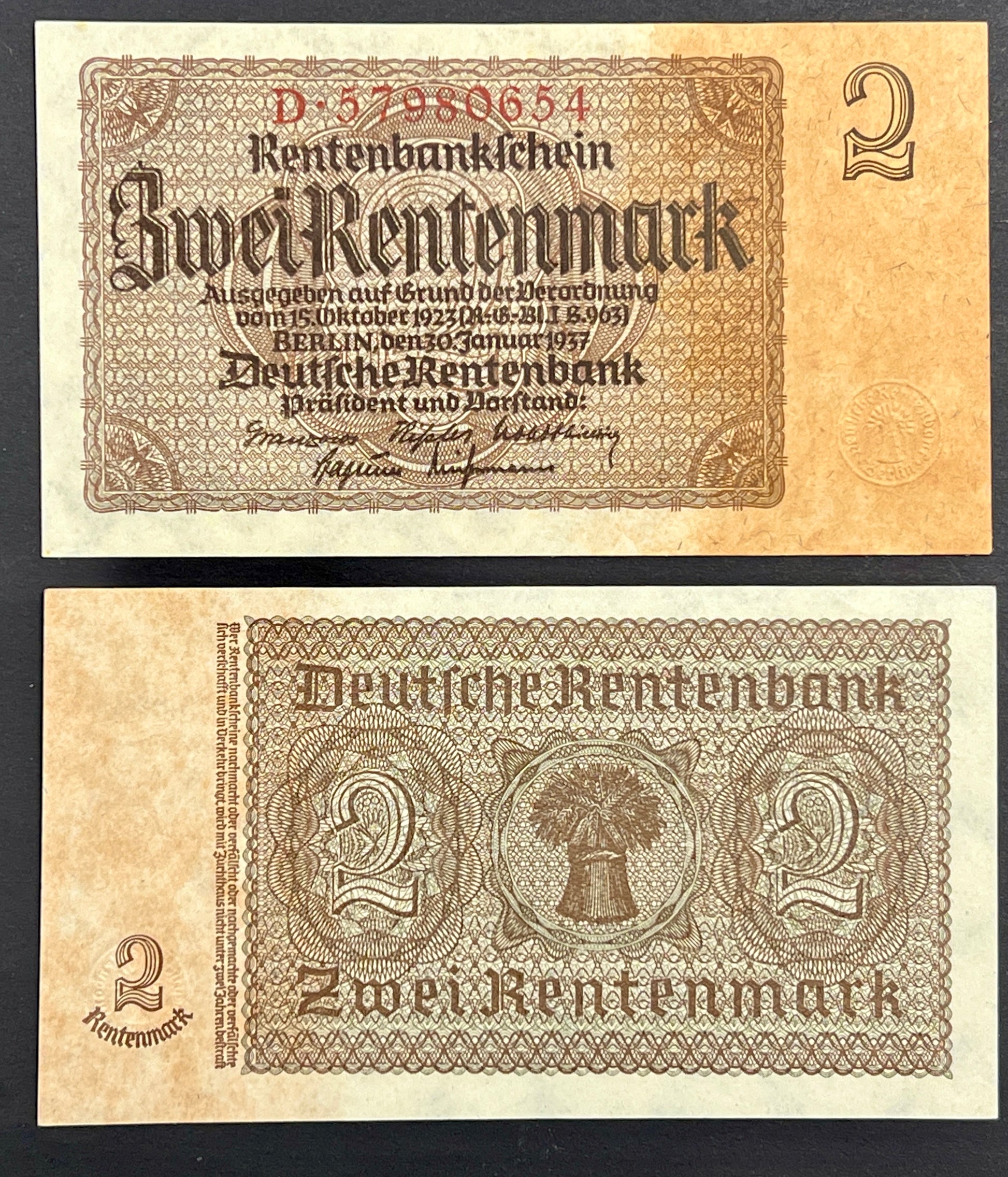 Front and reverse view of a crisp, vintage 1937 Germany 2 Rentenmark banknote featuring classic gothic typography and intricate geometric borders.
