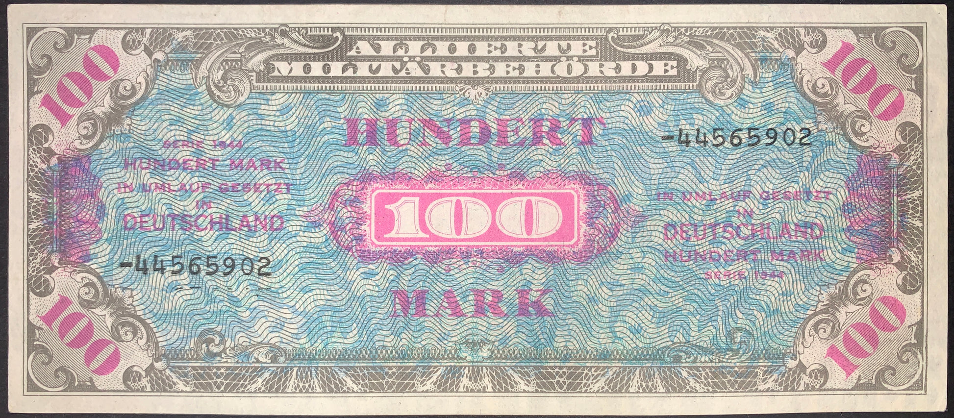 Germany Allied Military Currency 100 Marks banknote issued in 1944, Pick 197d, Very Fine condition. Blue and pink engraved security design with large central denomination and crisp paper quality. Historic post-war German occupation currency.