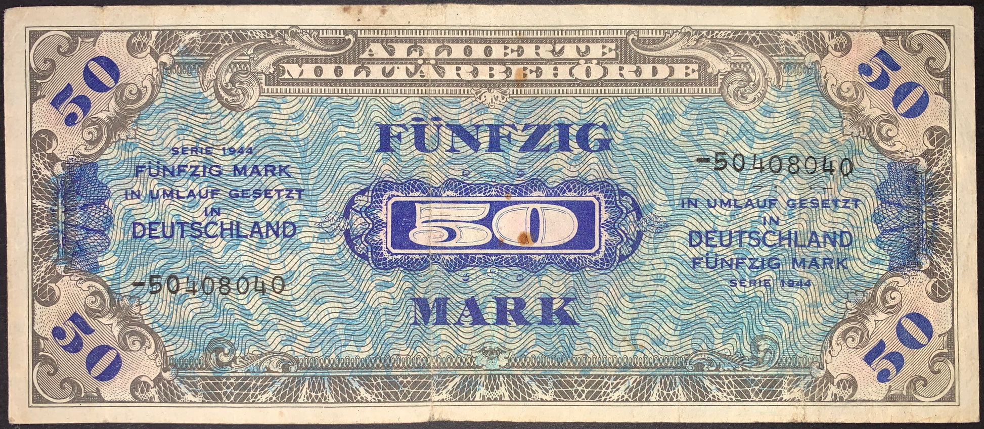 Germany Allied Military Currency 50 Marks banknote issued in 1944, Pick 196d, Fine condition. Intricate multicolor security patterns, bold denomination, and serial numbers. Emergency occupation money circulated in Allied-controlled Germany after World War II.