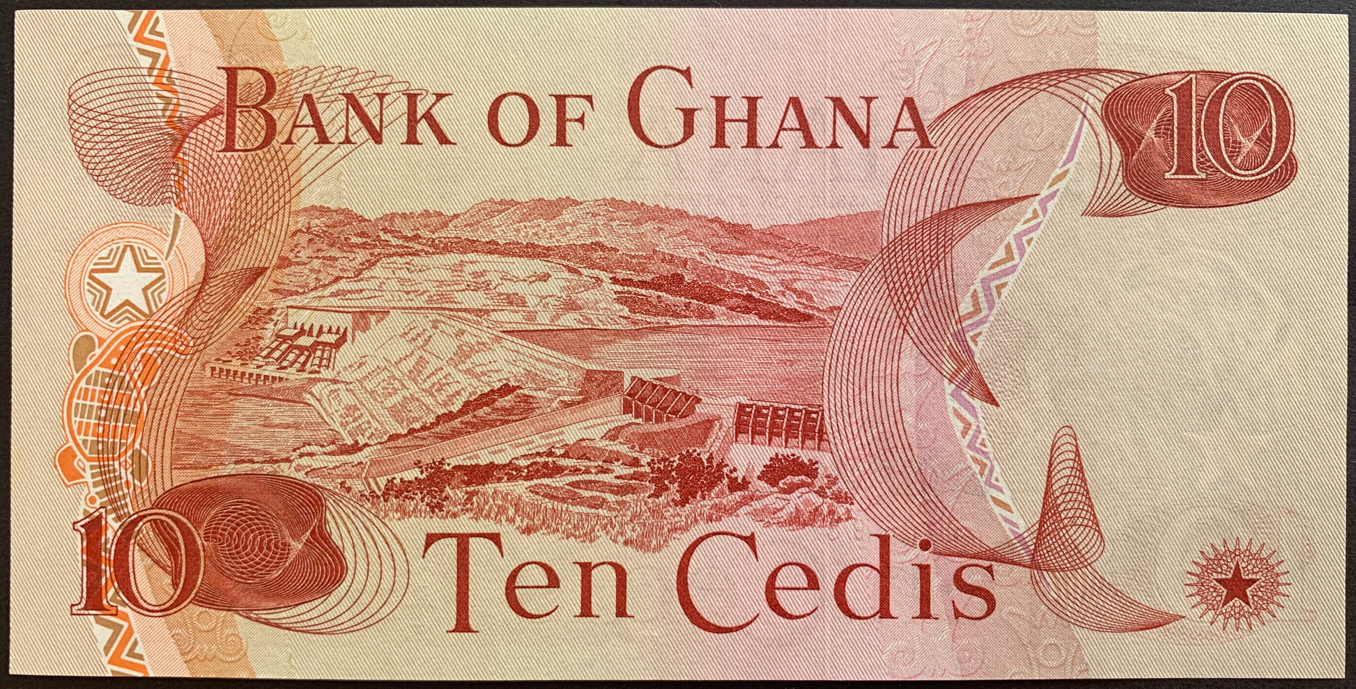 back of Ghana 10 Cedis 1978 P-16f collectible banknote with dam