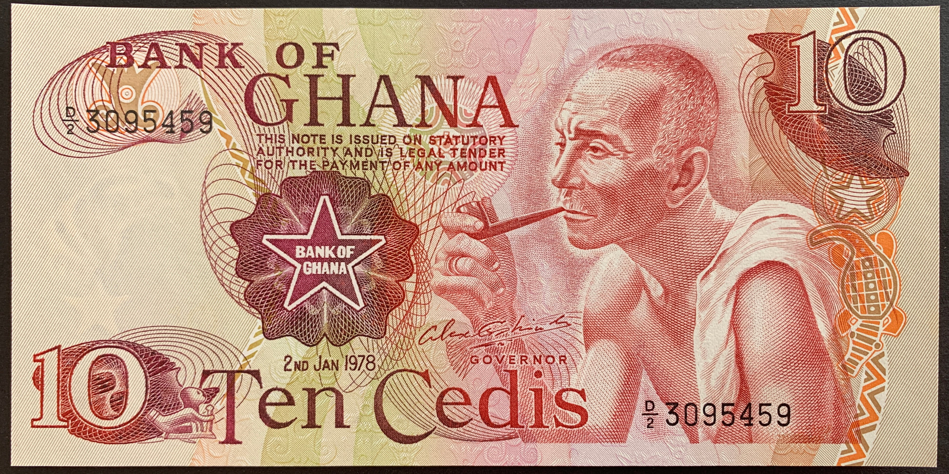 front of Ghana 10 Cedis 1978 P-16f collectible banknote with portrait of man smoking pipe 
