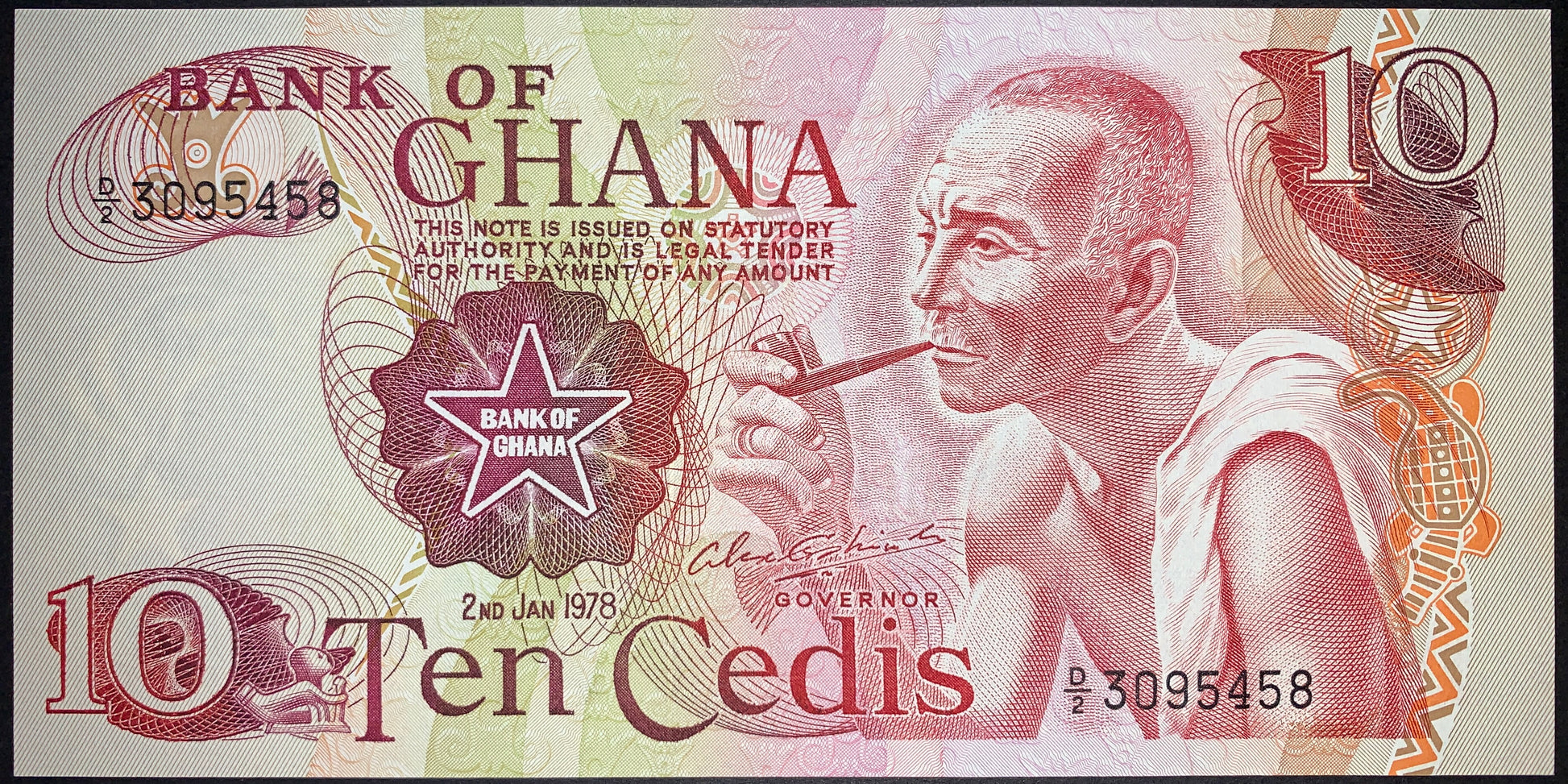 front of Ghana 10 Cedis 1978 P-16f collectible vintage banknote with elderly man smoking pipe