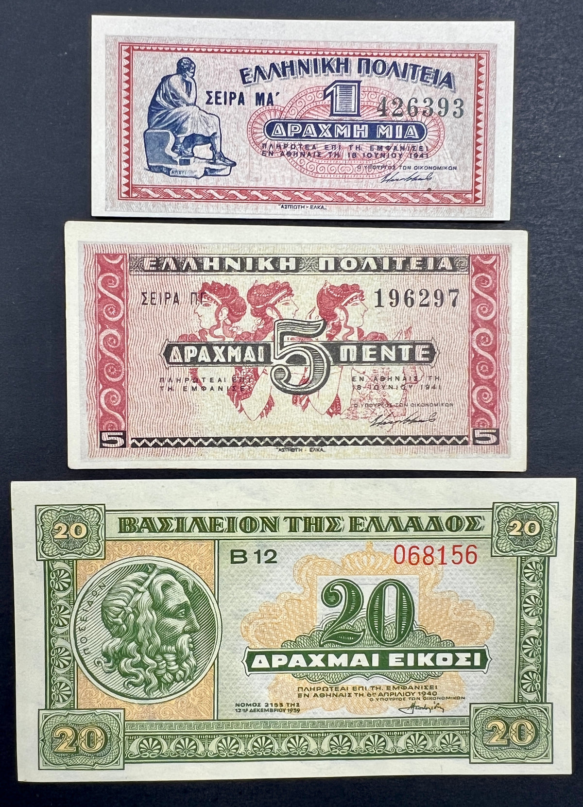 Front view of an uncirculated WWII era Greek banknote bundle featuring a 1941 1 Drachma, 1941 5 Drachmai, and 1940 20 Drachmai with classical art and Poseidon.
