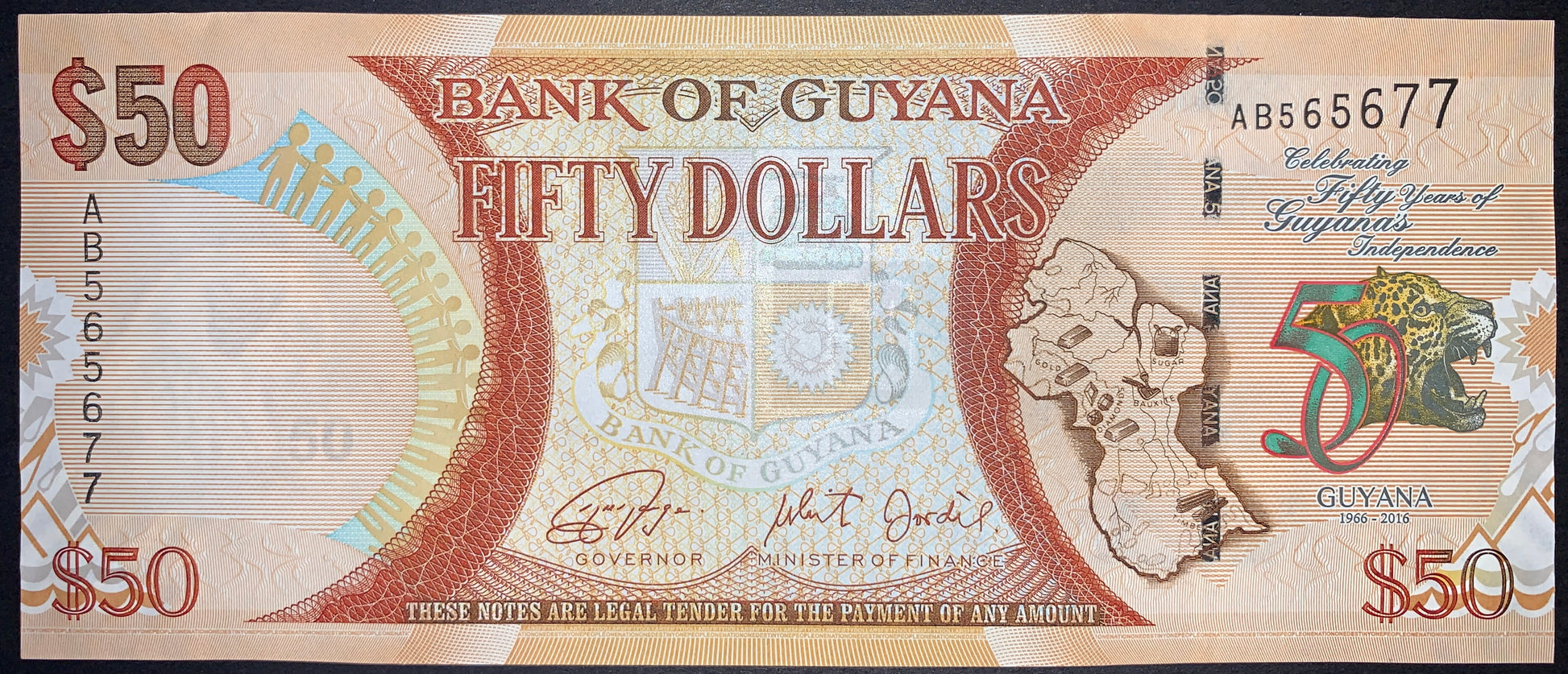 Guyana 50 Dollars 2016 P-41 UNC commemorative banknote obverse featuring the 50th Independence Anniversary logo, "Celebrating 50 Years of Independence" inscription, the Bank of Guyana building, national coat of arms, and map of Guyana.